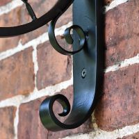 Close-up of the Black Scroll Design on the Bracket Close-up of the Black Scroll Design on the Bracket