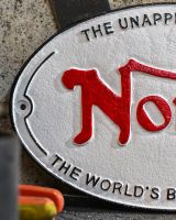 Close up of "Norton" Cast Iron Automobilia Reproduction Sign finish