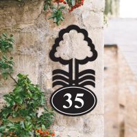Nottingham Tree Iron House Number Sign on a Garden Wall Nottingham Tree Iron House Number Sign on a Garden Wall