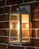 Digital representation of Oakley White Top Fix Wall Light lit up at night