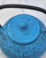 Close up of "Oketo" Lotus Flower Blue and Black Cast Iron Japanese Style Teapot lid Close up of "Oketo" Lotus Flower Blue and Black Cast Iron Japanese Style Teapot lid