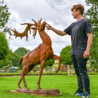 Cast Iron Stag Sculpture with Male for Scale Cast Iron Stag Sculpture with Male for Scale