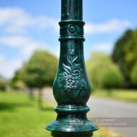 Orante Detail On Green Cast Iron Lamp Post Column