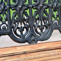Close up of Aged Black Cast Iron Backrest on Bench