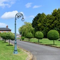 Ornate Cast Iron Globe Lamp Post On Driveway of period property Ornate Cast Iron Globe Lamp Post On Driveway of period property