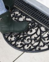 Scale Shot of Ornate Cast Iron "Sunrise" Semi Circle Door Mat in Black Scale Shot of Ornate Cast Iron "Sunrise" Semi Circle Door Mat in Black