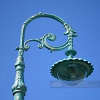 Ornate Scroll Bracket With Lantern Luminaire In Pale Blue Ornate Scroll Bracket With Lantern Luminaire In Pale Blue