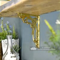 Ornate Scroll Brackets Finished in a Polished Brass