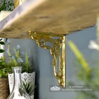 Ornate Scroll Polished Brass Brackets in Situ Holding up a Wooden Shelf