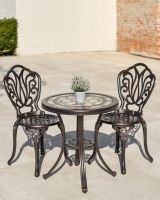 Ornate Two Chair Bistro Set with Mosaic Table Top in Use Outside on a Garden Patio Ornate Two Chair Bistro Set with Mosaic Table Top in Use Outside on a Garden Patio