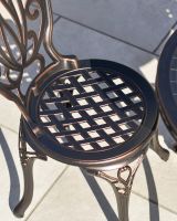 Antique Bronze "Lattice" Design on the Seat of the Chairs Antique Bronze "Lattice" Design on the Seat of the Chairs