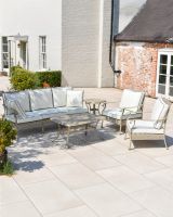 Wide shot of full lounge set with sofa, two chairs and two tables