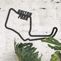 Oulton Park Motor Racing Circuit Wall Art on the Wall Next to Plants