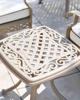 Close up shot of side table showing the lattice pattern and scrollwork detailing