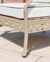 Close up shot of the chairs legs and ornate base.