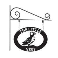 Close-Up of Oval Steel Puffin Hanging House Name Sign