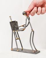 Scale image of the painter scrap metal art sculpture