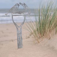 Pair of Siskins Sheet Steel Silhouette in Natural Steel Finish in Situ