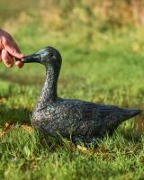 Pair of Verdigris Cast Aluminium Ducks Sitting Version with Hand in Shot for Scale