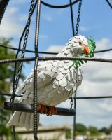 Close up of intricate dove and olive branch detail on art sculpture