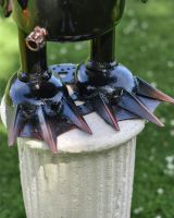 Close up of Penguin Diver Recycled Metal Sculpture feet