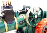 Period green steam engine tractor model