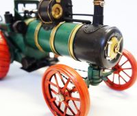 Period green steam engine tractor model