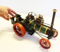 Period green steam engine tractor model