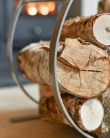Close-Up of Arched Contemporary Design on Pewter Blacksmith Curved Log Rack Close-Up of Arched Contemporary Design on Pewter Blacksmith Curved Log Rack