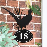 Pheasant Iron House Number Sign in Situ on a Brick Wall