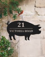 Pig Design House Name Sign Mounted on to a Rustic Wall