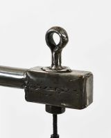 Close up of Industrial Style Pipe Lamp with Solid Wood Base finial