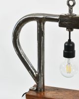 Close up of Industrial Style Pipe Lamp with Solid Wood Base stand