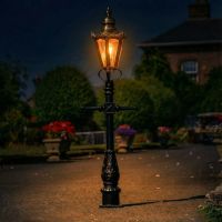 Polished Brass Concordia Hexagonal Miniature Lamp Post in Use Illuminated at Night