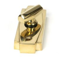 Close-Up of Polished Brass Art Deco Bathroom Thumb Lock Close-Up of Polished Brass Art Deco Bathroom Thumb Lock