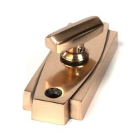 Close-Up of Polished Brass Art Deco Bathroom Thumb Lock Close-Up of Polished Brass Art Deco Bathroom Thumb Lock