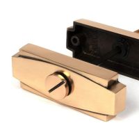 Close-Up of Connected Polished Brass Art Deco Bathroom Thumb Lock Close-Up of Connected Polished Brass Art Deco Bathroom Thumb Lock