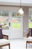 Polished Brass Bowl-Shaped Hanging Pendant Light with Hammered Brass Interior in Lounge Polished Brass Bowl-Shaped Hanging Pendant Light with Hammered Brass Interior in Lounge