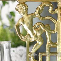 Polished brass cherub Wall bracket close up Polished brass cherub Wall bracket close up