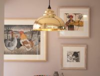 Polished Brass Curved Hanging Pendant Light with Smooth Brass Interior in Situ