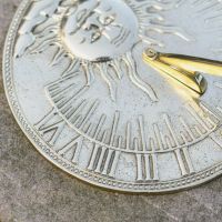 Close-Up of Roman Numeral Fixings on Polished Brass Finish