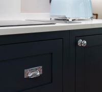 Polished Chrome Rectangular Drawer Pull with Curved Hammered Handle in Situ