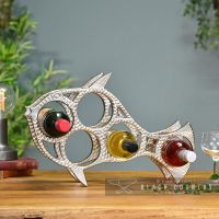 Polished Nickel "Fish" Wine Rack in Use Holding Wine Bottles Polished Nickel "Fish" Wine Rack in Use Holding Wine Bottles