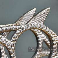 close-up of the Detail on the Polished Nickel "Fish" Wine Rack close-up of the Detail on the Polished Nickel "Fish" Wine Rack