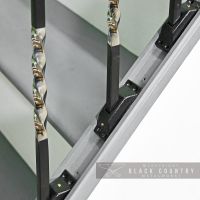 Close-up of the "Rabanne" Stair Spindles in Use with Rake Brackets Close-up of the "Rabanne" Stair Spindles in Use with Rake Brackets