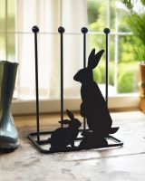Rabbit boot rack in front of patio door Rabbit boot rack in front of patio door