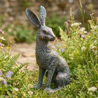 Digital illustration of verdigris ‘Hark’ Cast Aluminium Hare Garden Sculpturein a Spring garden