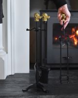 Scale image of dog head fireside companion set