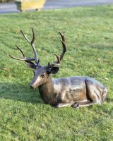 Lying stag sculpture high angle Lying stag sculpture high angle