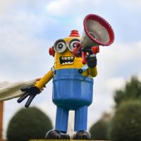 Scale Shot of Recycled Metal "Emergency Call" Minion Sculpture